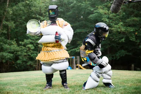 Two actors in homemade pillow armor on set